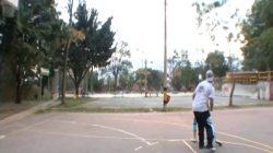Paris Milan plays basketball outdoors